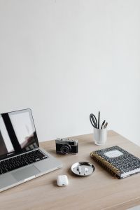 Kaboompics - Minimal Desk Workspace with Laptop, Camera and Notebook