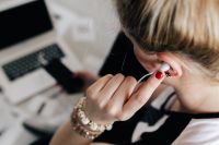 Kaboompics - Woman listening to music with earphones