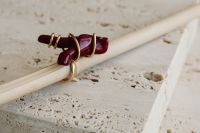 Kaboompics - Red and Black Beaded Earrings on White Rods