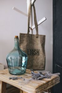 Kaboompics - Turquoise Glass Bottle and Canvas Tote on a Wooden Table