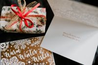 Kaboompics - Wrapped Christmas Present beside Greeting Card and Envelope