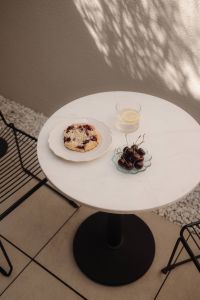 Kaboompics - Cherry Pastry and Fresh Cherries on an Outdoor Table