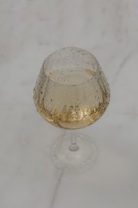 Kaboompics - Overhead Wine Glass on White Marble Table