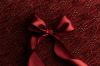 Kaboompics - Black Fan Ornament with Burgundy Ribbon