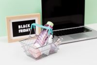 Kaboompics - Shopping Basket with Beauty Products and Laptop on Mint Background