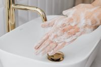 Kaboompics - Close-Up of Lathered Hands above a Sink Drain for Public Health Handwashing Content