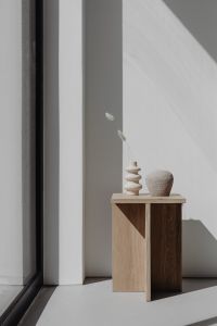 Kaboompics - Dried Stems in Ceramic Vases Beside a Sunlit Window and Oak Table