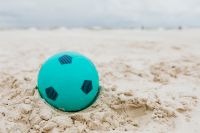 Kaboompics - Turquoise Beach Ball with Soft Sea and Sand Copy Space for Summer Design