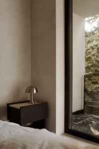 Kaboompics - Cozy Bedroom Corner with Metal Lamp, White Bedding and Natural Window Light