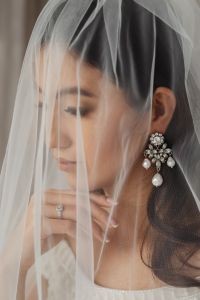 Kaboompics - Statement Chandelier Earring and Bridal Ring Beneath a Veil