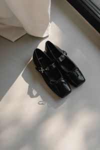 Kaboompics - Black Buckled Leather Shoes in Sunlight