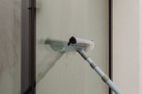 Kaboompics - Close-Up of Squeegee on Wet Window Glass