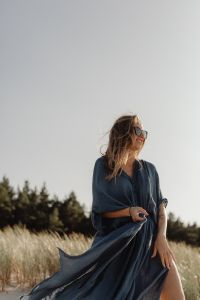 Kaboompics - Woman in Blue Kaftan Dress Walking in Sand Dunes