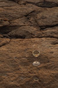 Kaboompics - Single Wine Glass on a Rough Coastal Ledge