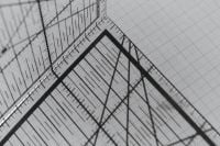 Kaboompics - Black Pattern Making Triangle on Grid Background