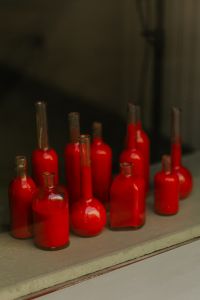 Kaboompics - Close-Up of Red Glass Bottle Shapes in a Shop Display