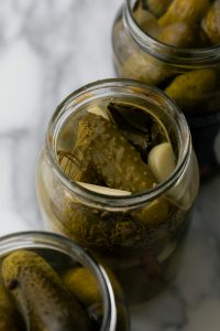 Kaboompics - Open Pickle Jar with Garlic, Dill and Bay Leaves, Close-Up