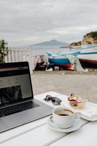 Kaboompics - Laptop and Cappuccino Against a Marina Waterfront