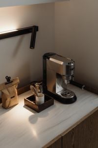Kaboompics - Stainless Steel Espresso Machine with Coffee Tools on Countertop