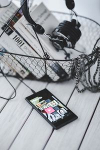 Kaboompics - Close Crop of Headphone Ear Cups over Printed Book Pages