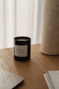 Kaboompics - Black Candle and Travertine Lamp on a Calm Neutral Desk