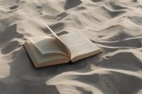 Kaboompics - Open Book on Wind-Rippled Sand with Copy Space
