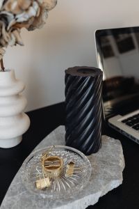 Kaboompics - Vertical Home Office Still Life with Black Candle, White Vase and Laptop
