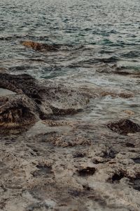 Kaboompics - Vertical Rocky Shore with Waves Breaking Along the Rock Shelf