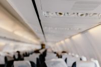 Kaboompics - Cabin inside the aircraft, lights, air condition and signs panel above the seat