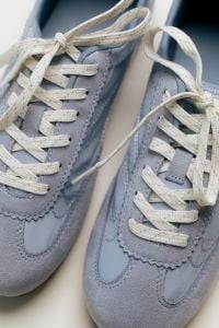 Kaboompics - Blue Sneakers and White Laces Close-Up