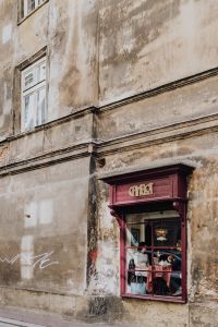 Kaboompics - Cafe Window in a Weathered Krakow Facade