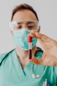 Kaboompics - Doctor Holding Blood Sample Tube Upright