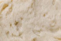 Kaboompics - Cream Skincare Texture with Air Pockets and Fine Grain, Beige Macro Beauty Background