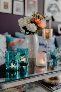 Modern Living Room Decor with Blue Accent Pillows, Glass Coffee Table and Cozy Sofa