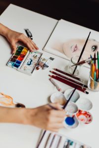 Kaboompics - A woman paints with watercolors