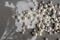Kaboompics - Pearl Bead Flat Lay on Gray Concrete with Textured Copy Space, Horizontal