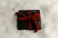 Kaboompics - Close Up Burgundy Gift Box with Velvet Bow in Snow