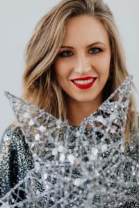 Kaboompics - Christmas Party Portrait with Woman Holding a Silver Star