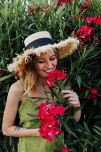 Summer Lifestyle Portraits of a Woman Among Pink Flowers