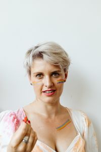 Kaboompics - Blonde Woman with Rainbow Face and Chest Paint for Pride