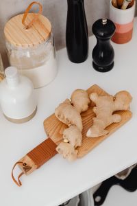 Kaboompics - Minimal Kitchen Counter with Flour Jar, Wooden Spoons and Black Pepper Mills