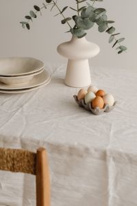 Kaboompics - Pastel Easter Eggs Beside White Vase And Plates