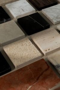 Kaboompics - Mixed Marble, Travertine and Limestone Swatches on a Neutral Surface
