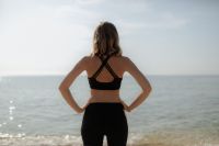 Kaboompics - Woman in Black Activewear Facing the Ocean