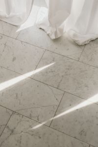 Kaboompics - Sunlit Marble Floor and White Curtains