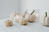 Kaboompics - White Mini Pumpkins and Glass Candles on White Linen