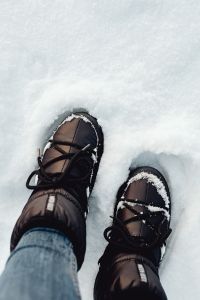 Kaboompics - Black Winter Boots Pressing Through Deep Snow