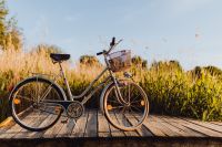 Kaboompics - Bicycle with basket on the pier in bright sunset light