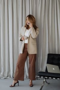 Kaboompics - Businesswoman on a Call with a Cup beside a Laptop