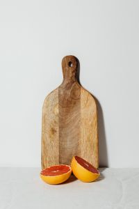 Kaboompics - Grapefruit on a Wooden Board for Fresh Citrus Food Styling